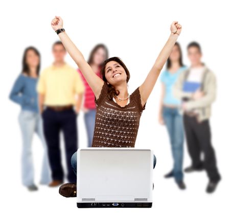 Casual successful girl with computer and a group behind