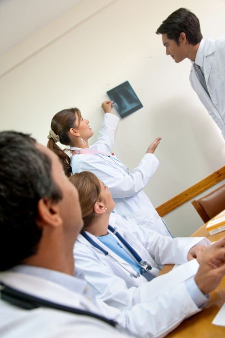 Group of doctors looking at an x ray picture