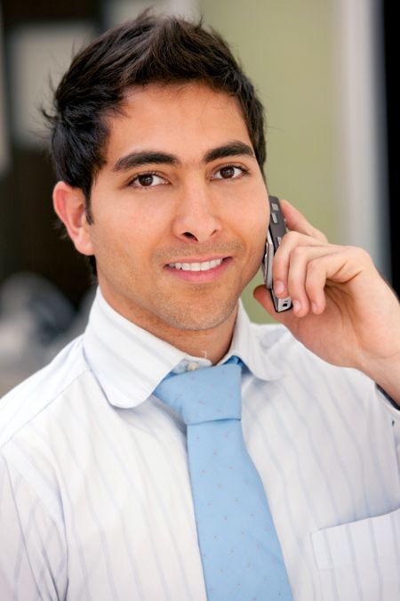 Business man talking on the phone and smiling