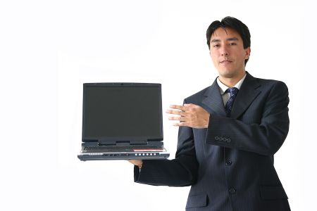 young business man showing a laptop