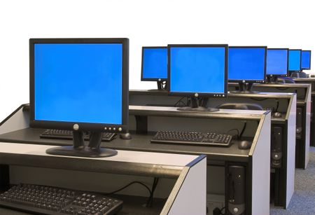 computer room full of black screens with a blue background