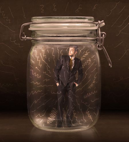 Businessman inside a jar with powerful hand drawn lines concept on bakcground