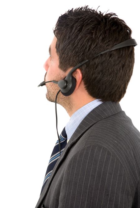 business male customer service representative looking at a screen behind him