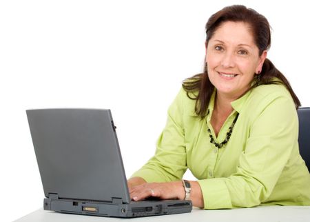 senior business woman on a laptop - isolated over a white background
