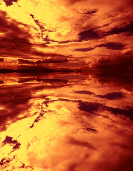 sky is on fire with reflection on water