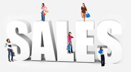 Beautiful shopping women around the word "sales" isolated
