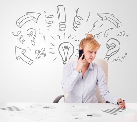 Attractive young businesswoman brainstorming with drawn arrows and symbols