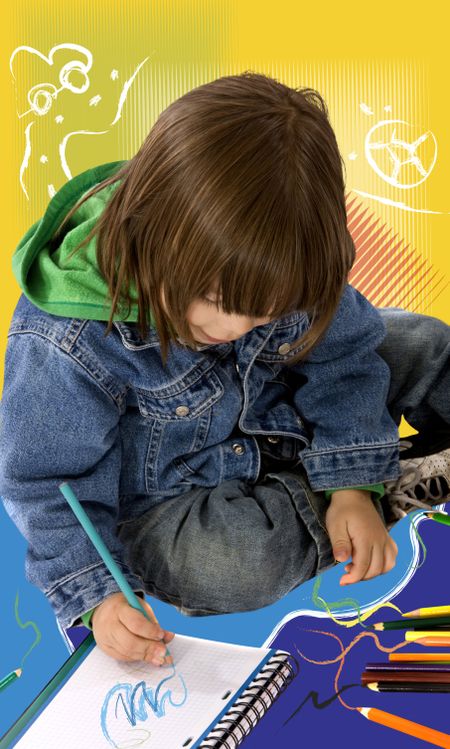 boy colouring on a notebook over a colorful background