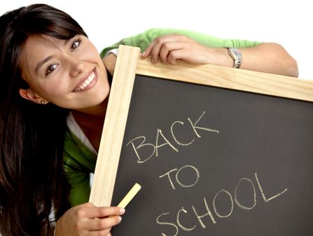 Woman writing 'back to school' on a chalkboard isolated