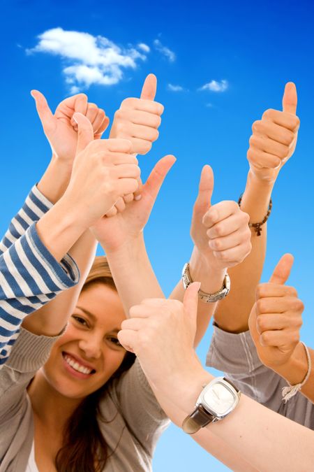 Thumbs up isolated over a blue background