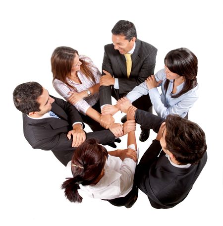 Business group with their hands together isolated
