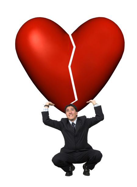 business man lifting a broken heart isolated