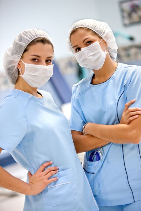 Female surgeons at a hospital with uniform and face mask
