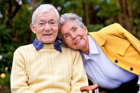 portrait of a loving elderly couple outdoors