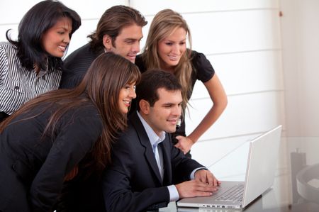Business team working with a laptop at an office