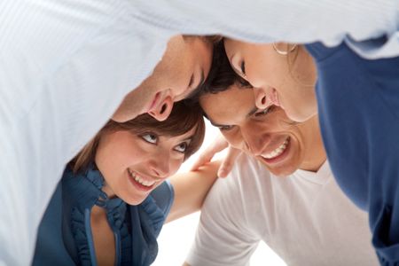 Group of people smiling with heads together isolated
