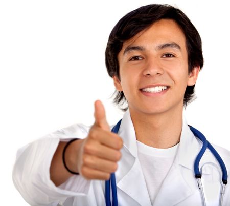 Male doctor with thumbs up smiling isolated on white