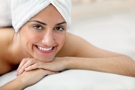 Beauty portrait of a woman with a towel on her head