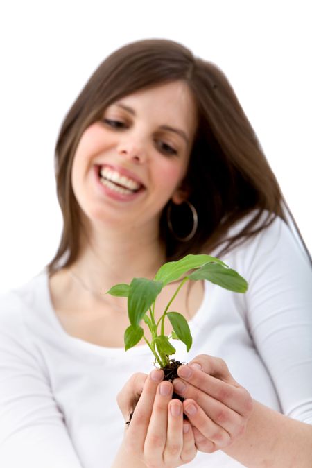 beautiful woman holding a plant isolated over a white background