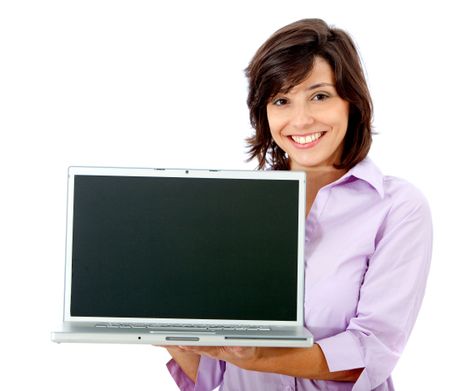 Happy woman displaying a laptop isolated on white