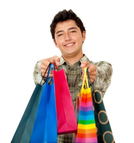 Shopping man holding some bags in front of his face - isolated