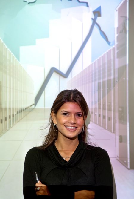 Business woman with a growth graph smiling