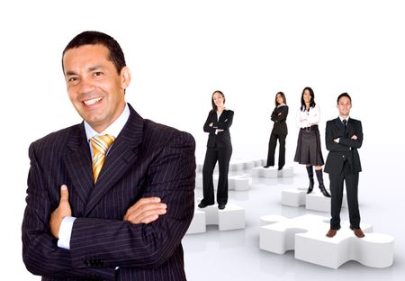 businessman with his teamwork on puzzle pieces isolated over a white background