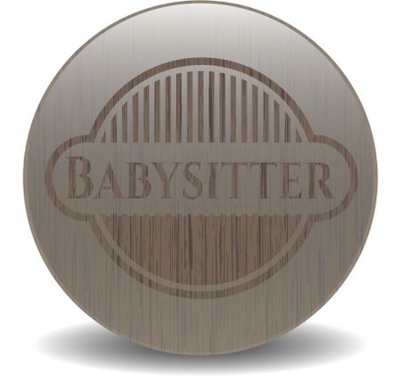 Babysitter badge with wood background