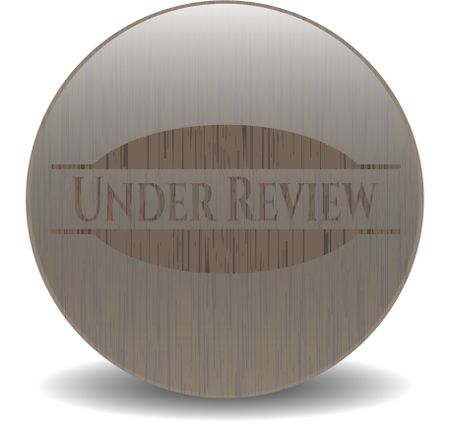 Under Review retro style wood emblem