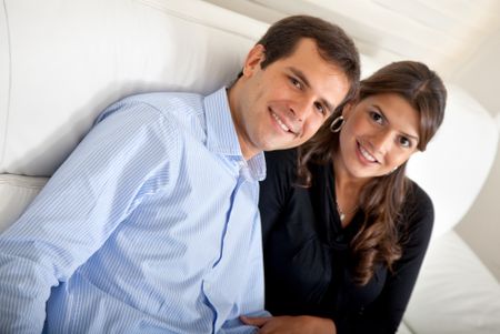 Beautiful loving young couple at home smiling