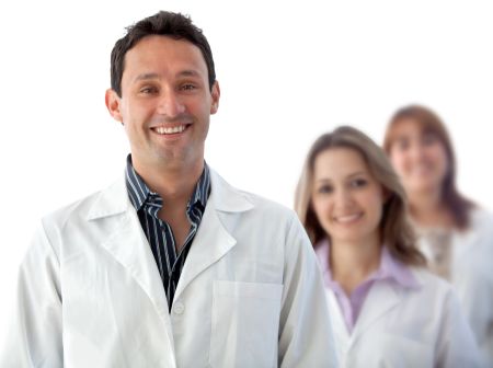 Male doctor with a group isolated over a white background