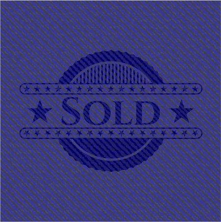 Sold emblem with jean background
