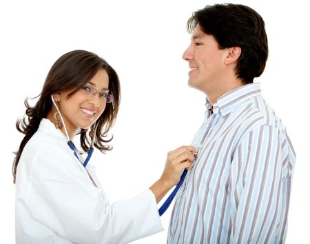 Female doctor assessing a patient with a stethoscope - isolated over white
