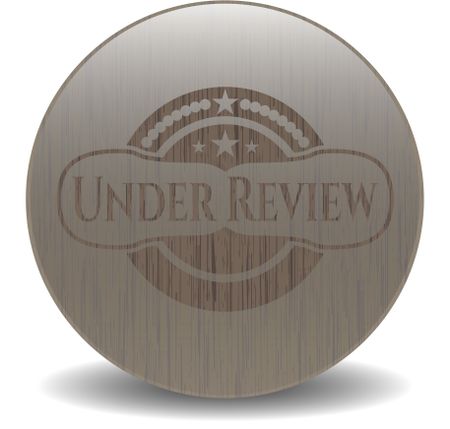 Under Review vintage wood emblem