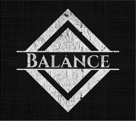 Balance chalkboard emblem on black board