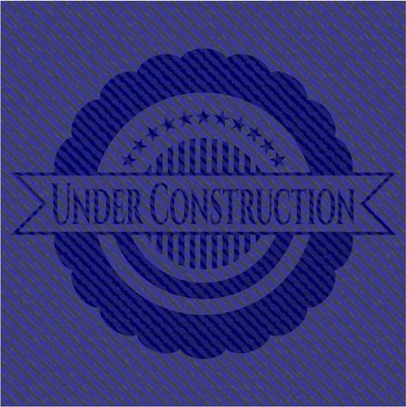 Under Construction jean or denim emblem or badge background
