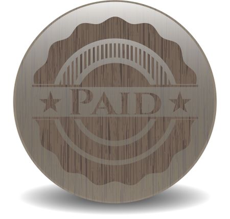 Paid badge with wood background