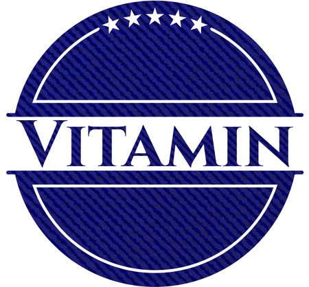 Vitamin emblem with jean background
