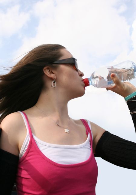 girl drinking water from a bottle