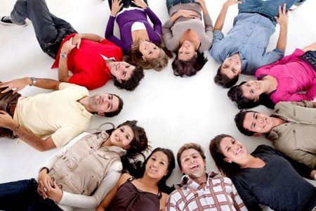 large group of people with their heads together on the floor