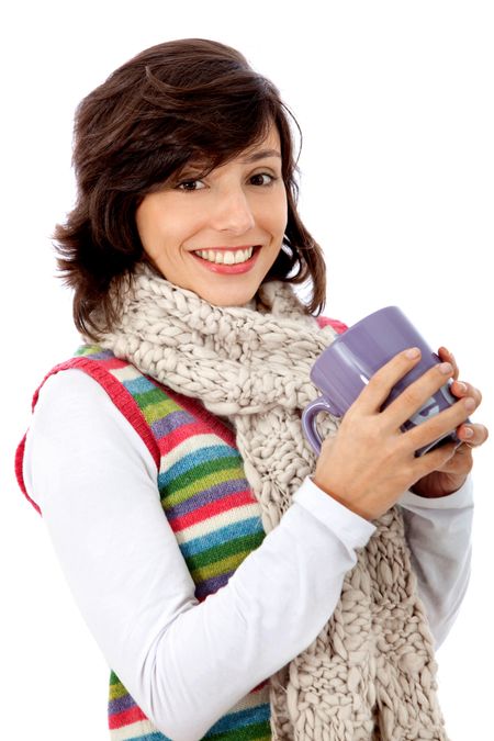 Cold woman drinking hot chocolate isolated over a white background