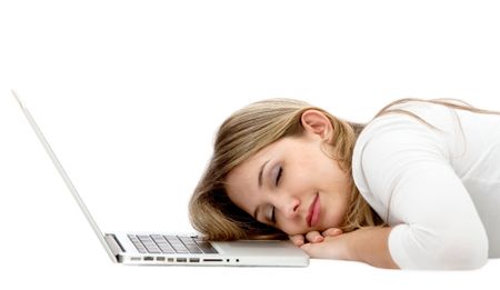 Tired woman sleeping in front of the computer isolated on  white