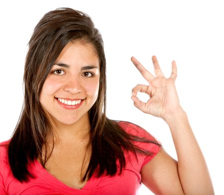 casual girl smiling doing the ok sign isolated over a white background