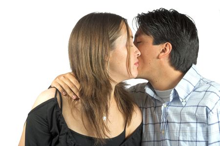 couple kissing with eyes closed over a white background