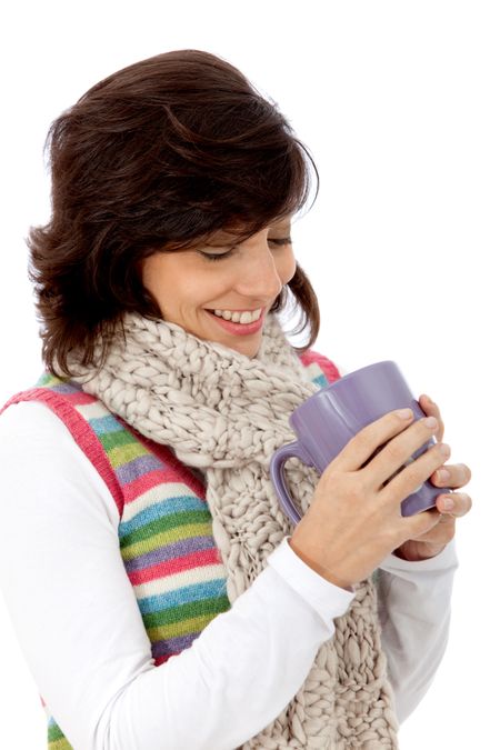 Winter woman with hot drink isolated over a white background