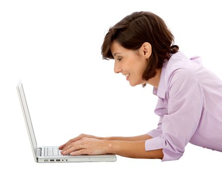 business woman with a laptop computer lying on the floor over a white background