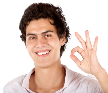 casual man smiling and doing ok sign with his hand - isolated over a white background