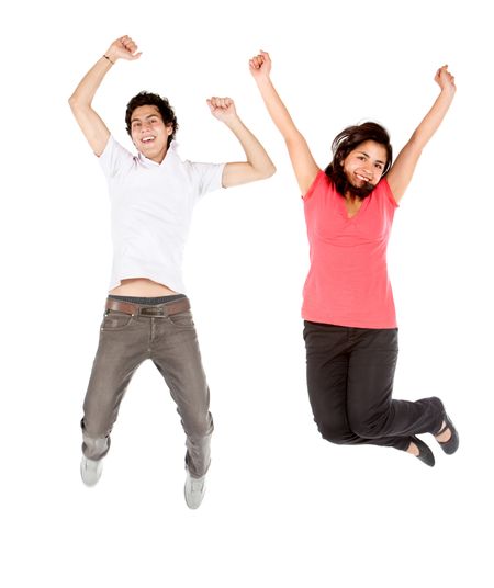Happy couple jumping isolated over a white background