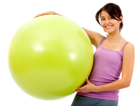 fitness woman smiling with a pilates ball isolated over a white background
