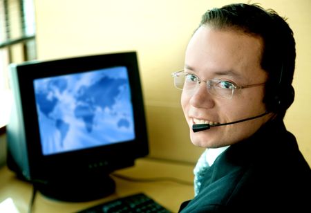 customer service representative in front of his office computer